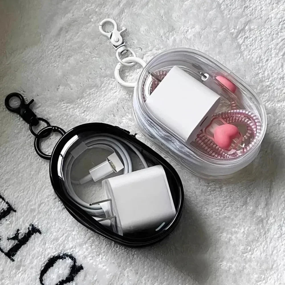 Clear round Data Cable Storage Box for travel and headset organization

