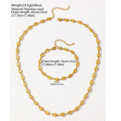 Stainless steel necklace and bracelet jewelry set on white background