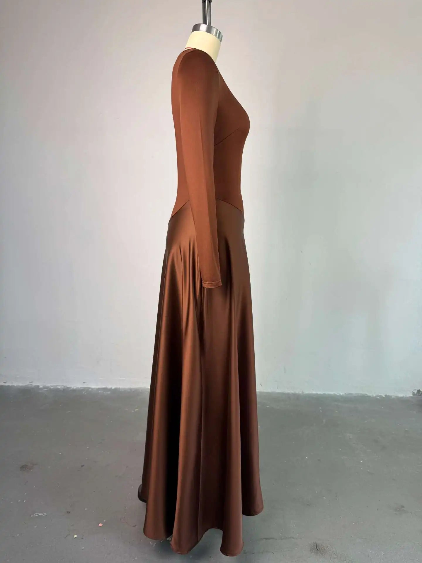 Woman in a one shoulder maxi dress with patchwork design, perfect for summer parties and evening events.