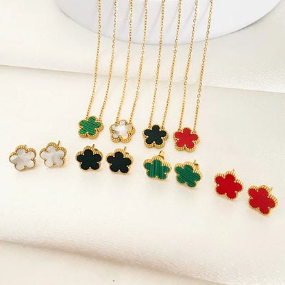 3-piece stainless steel plum blossom jewelry set on white background