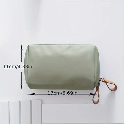 Portable makeup bag with solid color design for travel and daily cosmetic storage