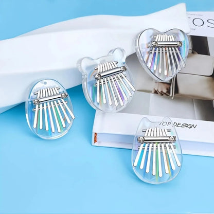 Mini Kalimba with 8 keys in transparent rainbow acrylic heart-shaped body

