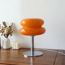 Macaron Retro Glass Table Lamp glowing on a bedside table