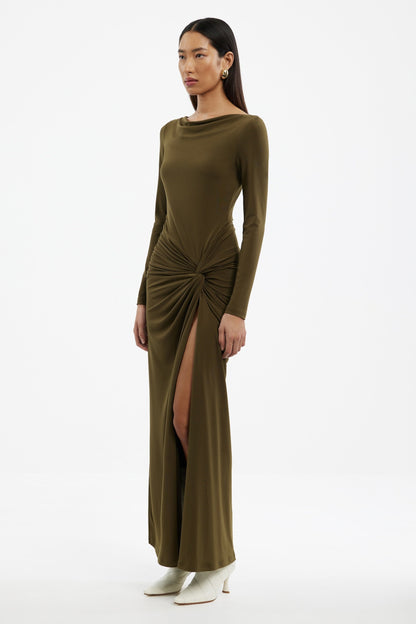 Woman wearing a Sarlyn long sleeve maxi dress with floral print, ideal for elegant casual and seasonal outfits.