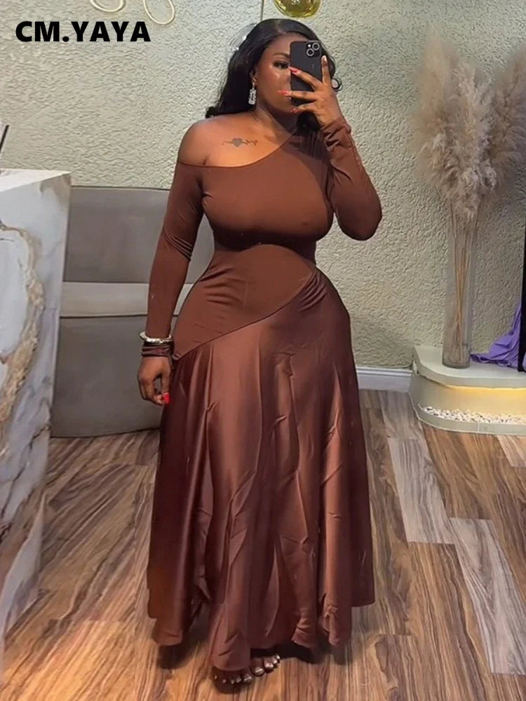 Woman in a one shoulder maxi dress with patchwork design, perfect for summer parties and evening events.