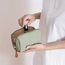 Portable makeup bag with solid color design for travel and daily cosmetic storage