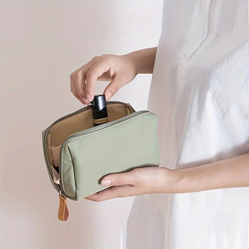 Portable makeup bag with solid color design for travel and daily cosmetic storage