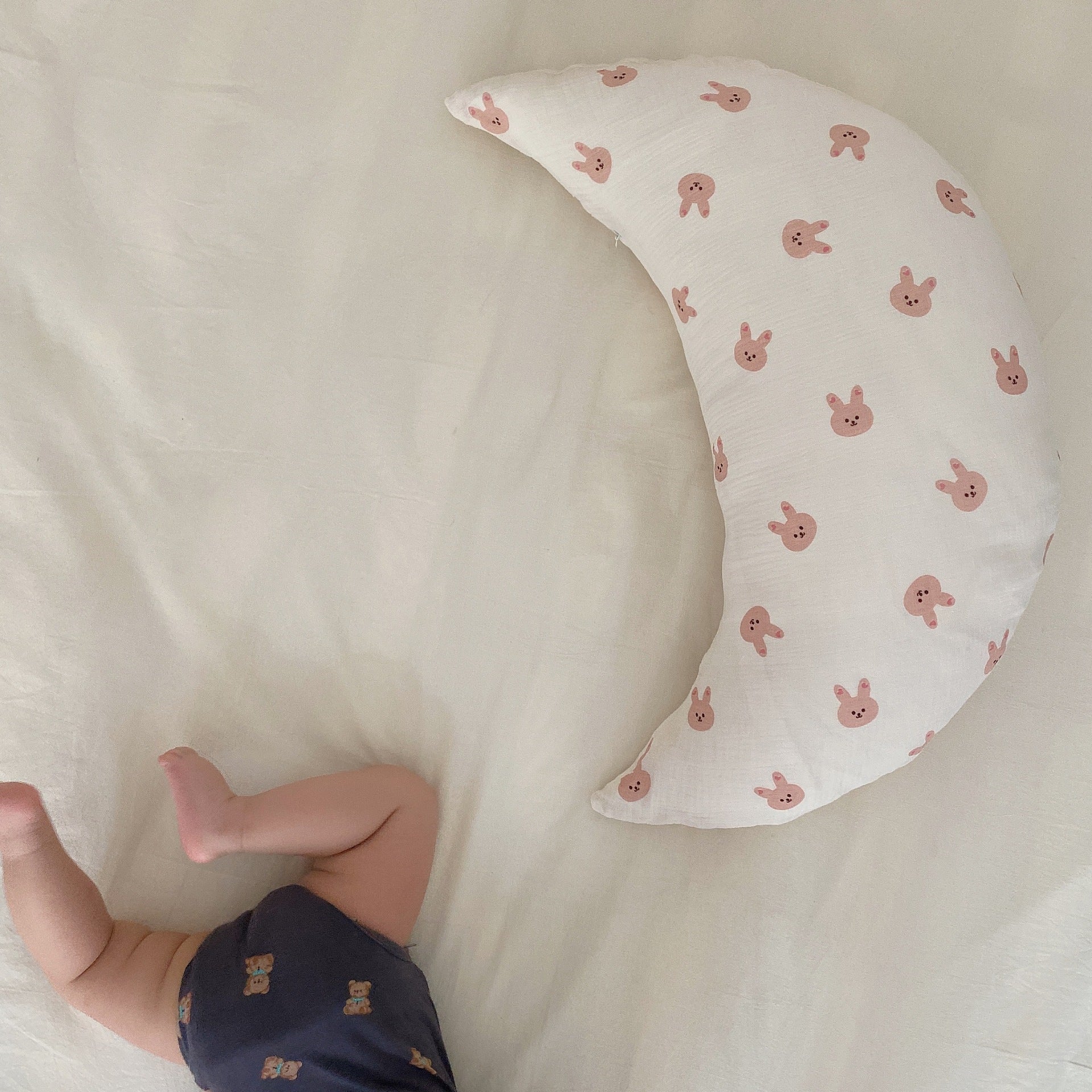 Soft baby sleeping crescent pillow with cartoon print for neck and head support

