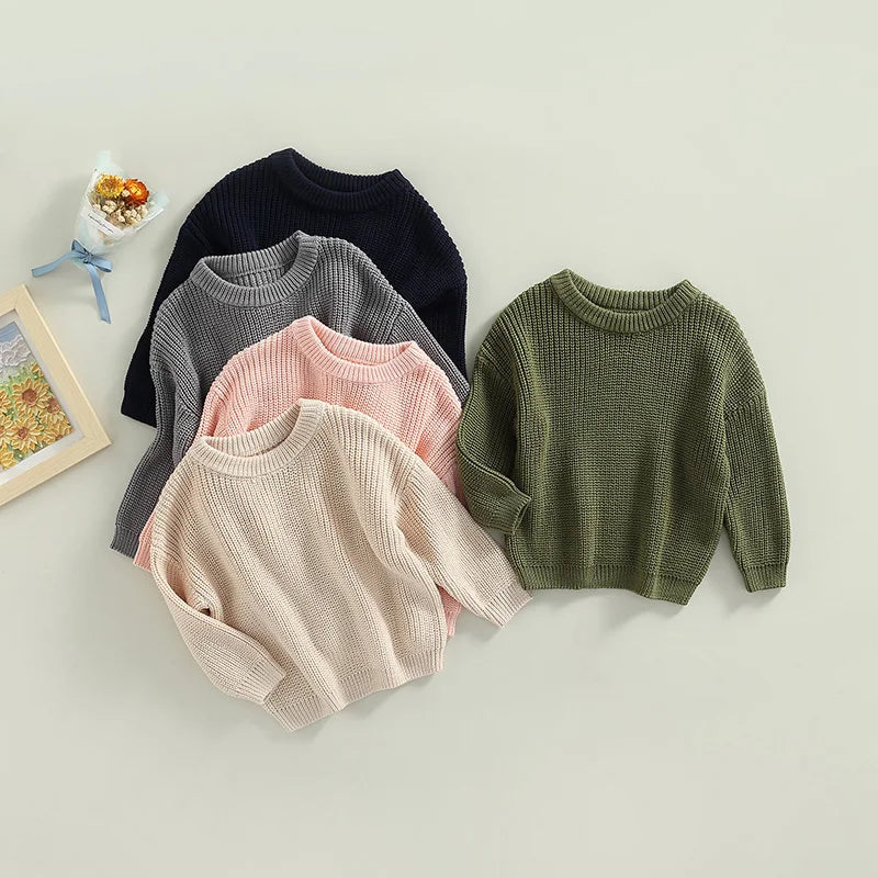 Toddler wearing cozy knit sweater for winter warmth

