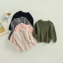 Toddler wearing cozy knit sweater for winter warmth

