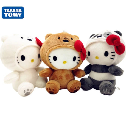 A set of three Sanrio character plush toys, including a white cat-like character, a brown bear, and a black and white character with a bow, designed as soft stuffed dolls.