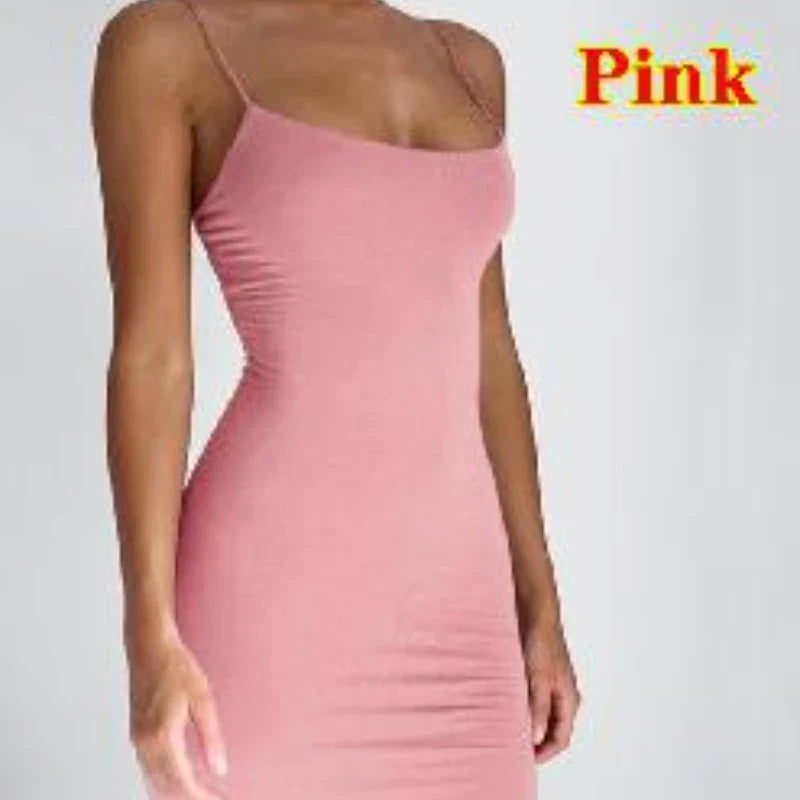 Woman in a summer spaghetti strap mini dress at a sunny beach outing