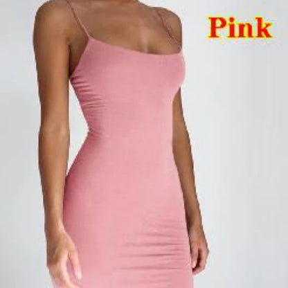 Woman in a summer spaghetti strap mini dress at a sunny beach outing