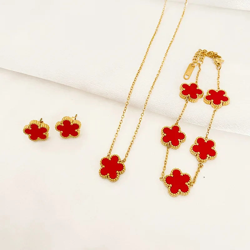 3-piece stainless steel plum blossom jewelry set on white background