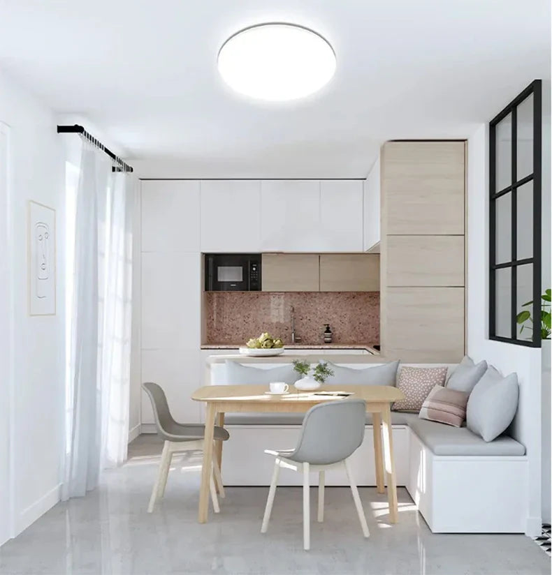 Sleek Stylish Ultra-Thin Round LED Ceiling Light illuminating a modern bedroom
