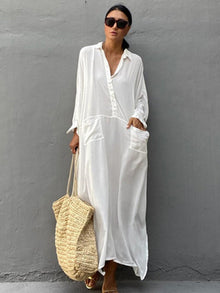 Woman wearing a white maxi beach dress kaftan as a swimsuit cover-up, perfect for summer beach and pool outings.
