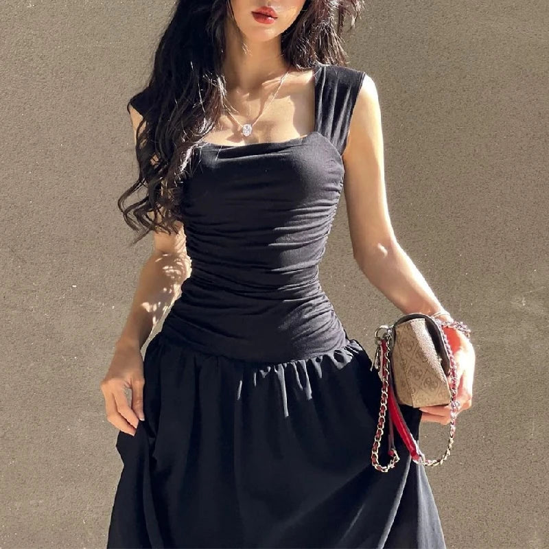 Woman in a sexy black maxi dress with ruched bodycon design, perfect for summer parties and evening events.