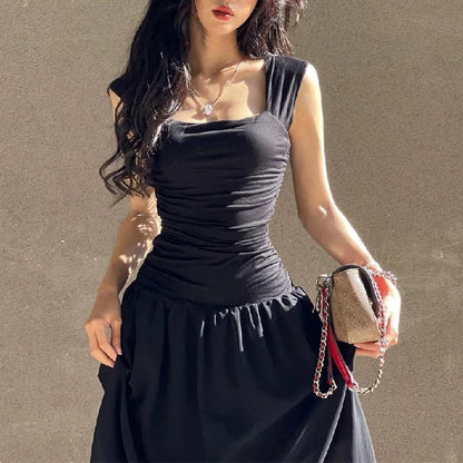 Woman in a sexy black maxi dress with ruched bodycon design, perfect for summer parties and evening events.