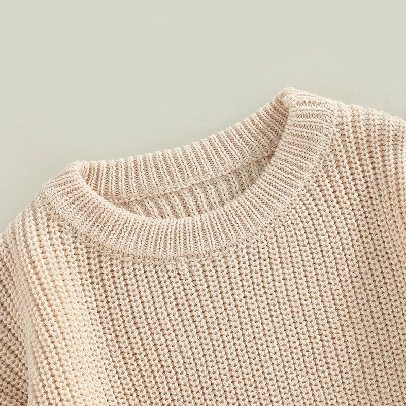 Toddler wearing cozy knit sweater for winter warmth

