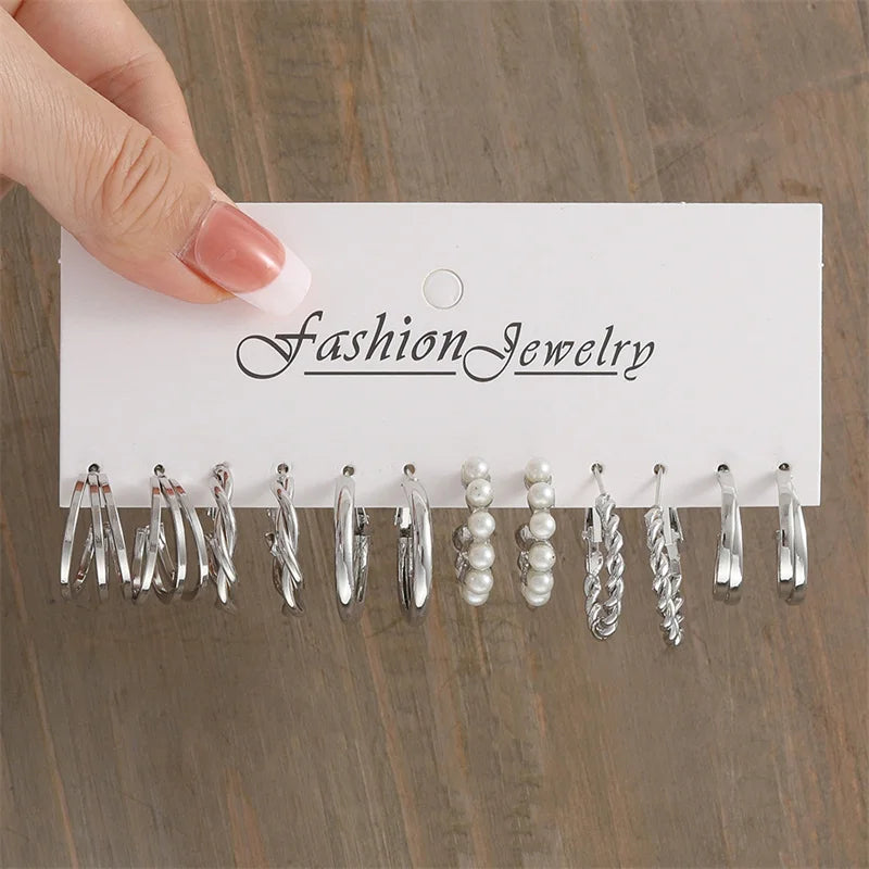 Close-up of elegant style hoop earrings with glossy finish and faux pearl accents