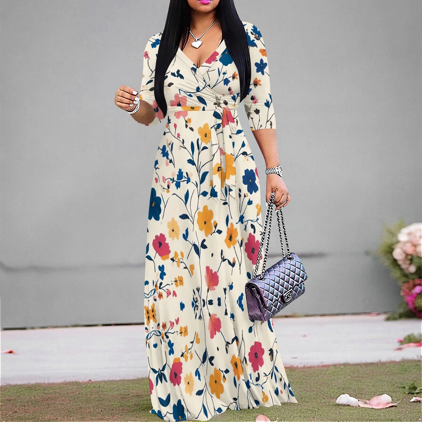 Woman in a vintage floral maxi dress with V-neck and ruched belt, perfect for casual summer style.