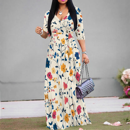 Woman in a vintage floral maxi dress with V-neck and ruched belt, perfect for casual summer style.