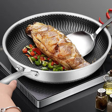 Tri-ply stainless steel double-sided nonstick frying pan with ergonomic handle for easy flipping


