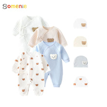 A collection of baby bodysuits in various designs, colors, and patterns, including plain, animal printed, and geometric designs, accompanied by matching hats.