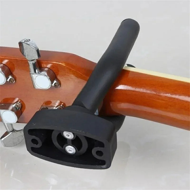 Heavy-duty guitar holder wall mount with padded hook for secure instrument display

