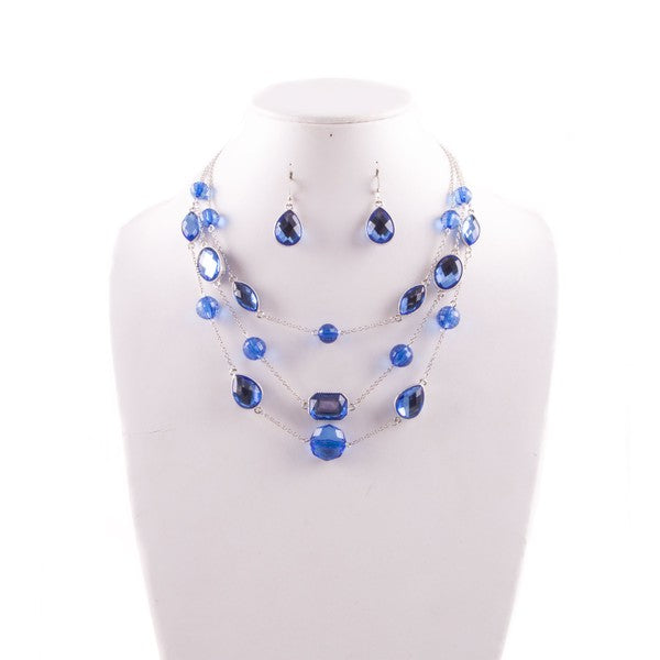 Silver-tone blue gem necklace and earrings set with layered waterfall design
