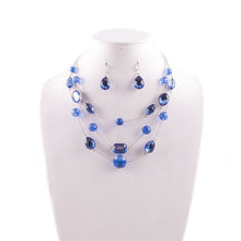 Silver-tone blue gem necklace and earrings set with layered waterfall design