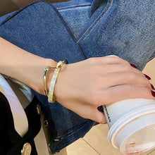 Close-up of Metal White Shellfish Plate Bracelet for Women, adjustable two-layer design with light luxury style