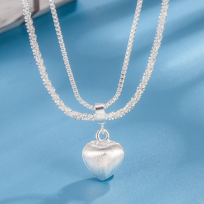 Women’s double layer heart pendant necklace with brushed finish