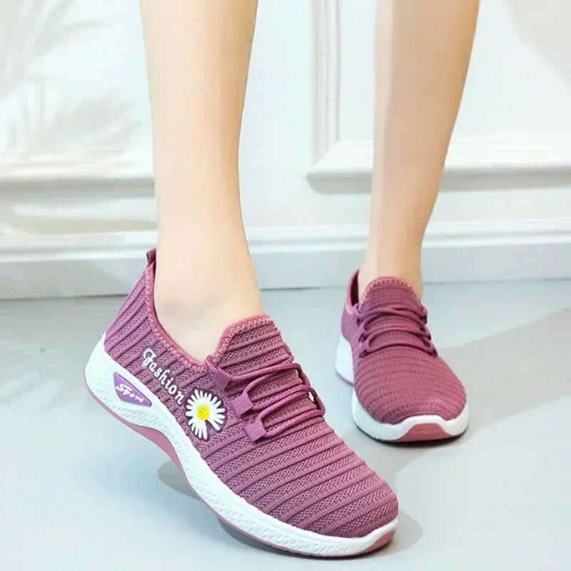 Woman wearing lightweight breathable casual sneakers outdoors

