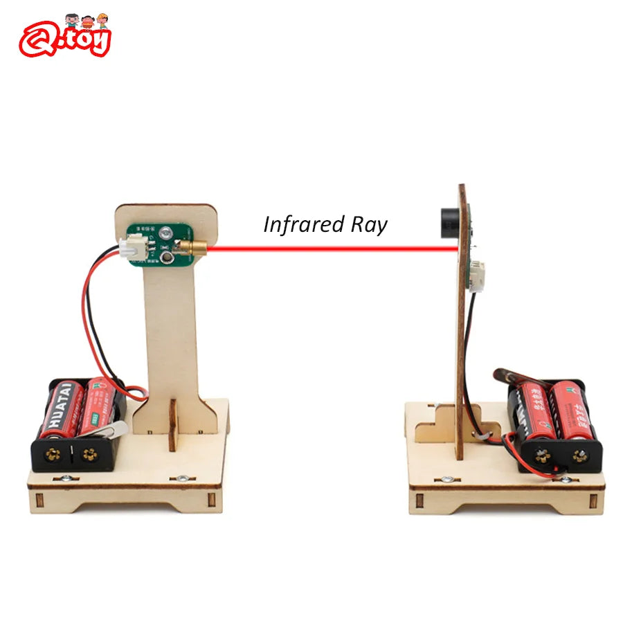 Child building DIY infrared alarm STEM kit on table