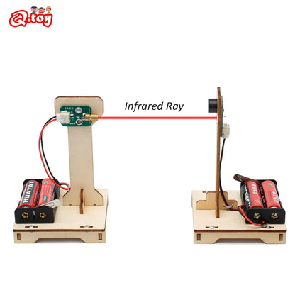 Child building DIY infrared alarm STEM kit on table