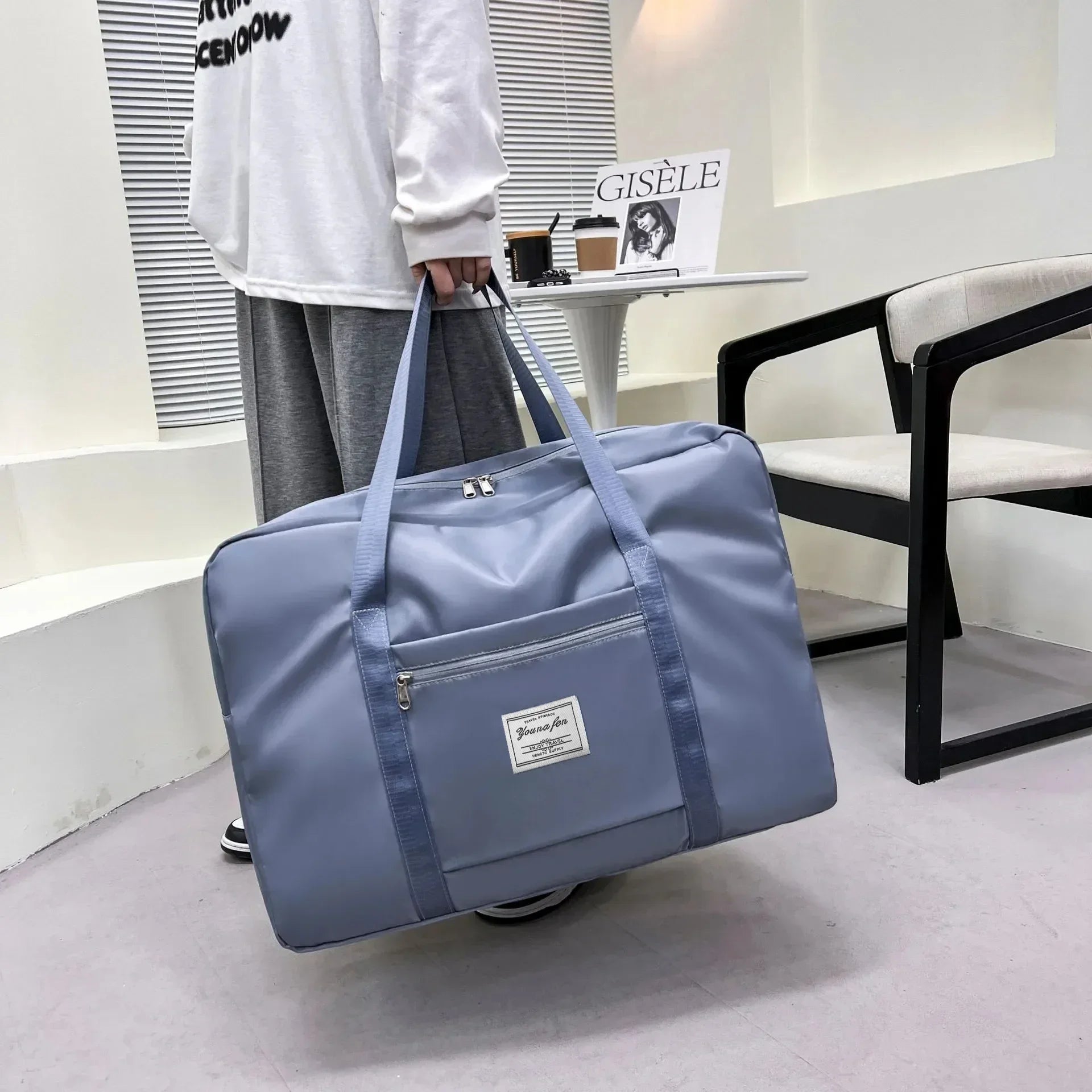 Large capacity travel bag with zipper and handles for gym, sports, and daily use
